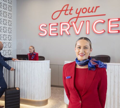 Virgin Australia staff greeting guests at Virgin Australia lounge
