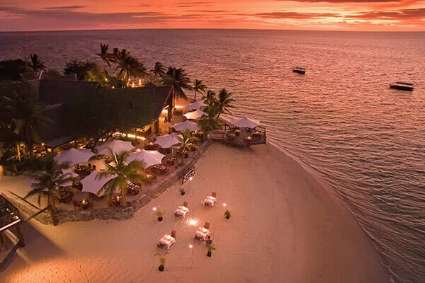 Dinner on the beach at sunset on Castaway Island Resort Fiji
