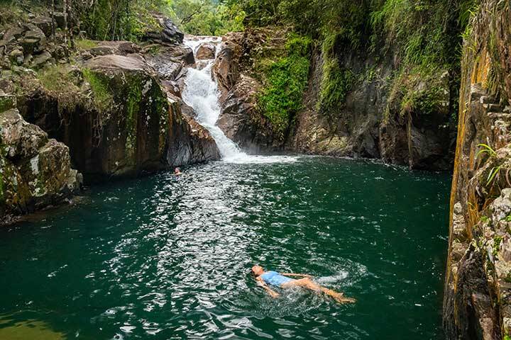 Lady swimming in a rock pool at Finch Hatton Gorge
