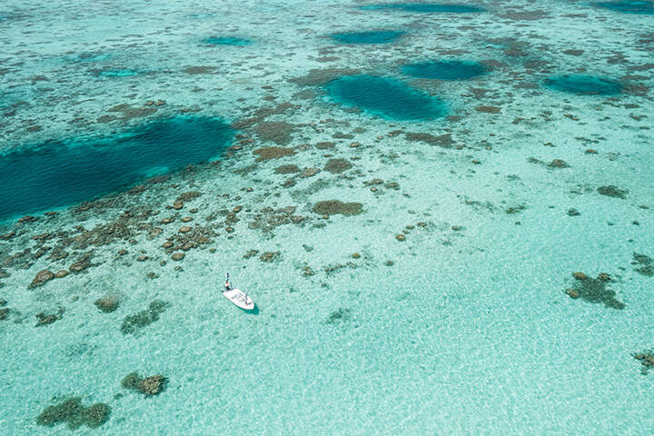 Aerial view of clear blue water on Cocos Keeling Islands