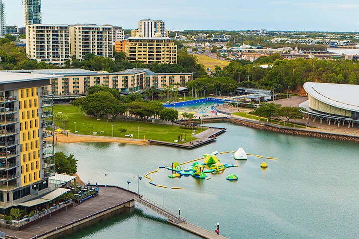 Aerial of Darwin Waterfront. Darwin Waterfront is home to the Wave Pool and also safe swimming Recreation Lagoon. Cafes and restaurants offer plenty of opportunities to refuel after a morning swim, linger over a luxurious lunch, or meet up with friends for a sundowner.