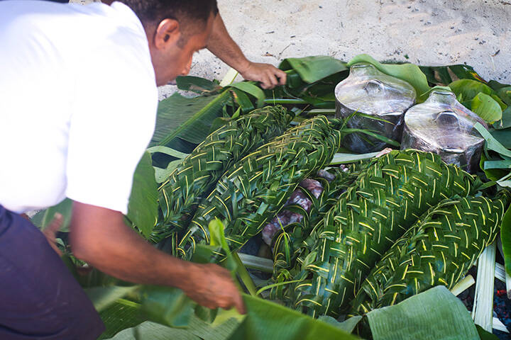 Traditional lovo meal wrapped in banana leaves in Fiji