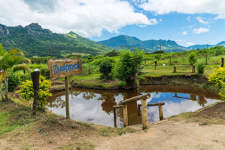 Sabeto Hot Springs and Mud Pool surround by lush green mountains in Fiji