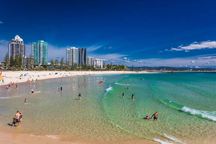 Beach goers and swimmers at Coolangatta Beach in Gold Coast