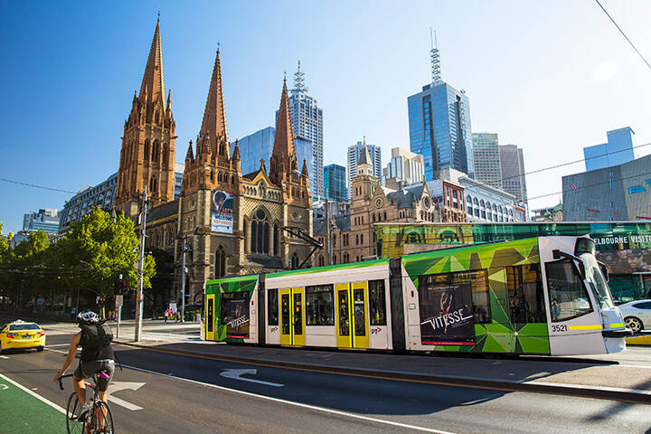 Tram passing St Paul's Cathedral, Swanston Street, Melbourne