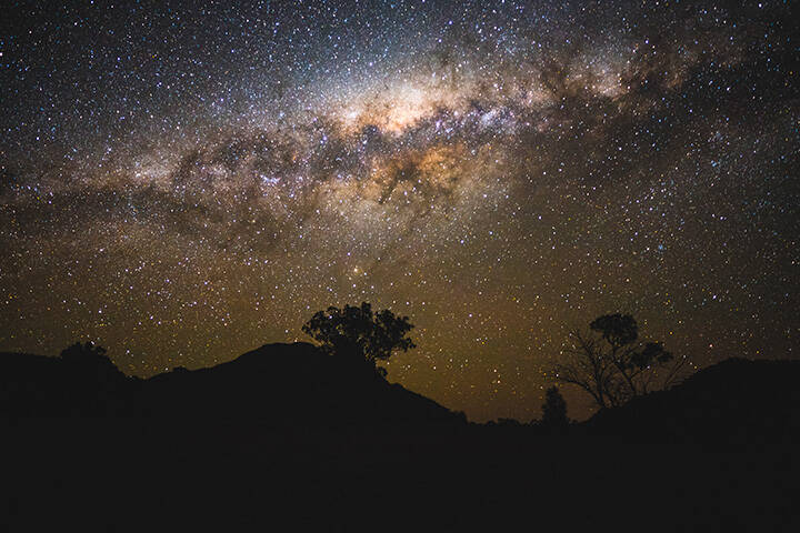 The night sky filled with bright stars over the dark sky park in the Warrumbungles