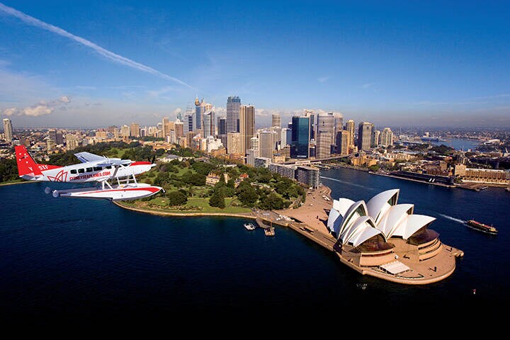 A Sydney Seaplane flying over Sydney harbour