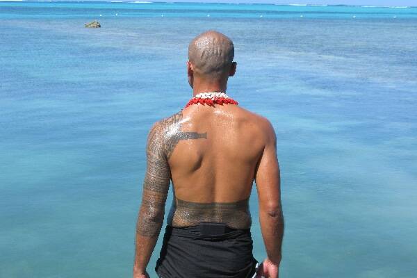 Samoan man overlooking ocean