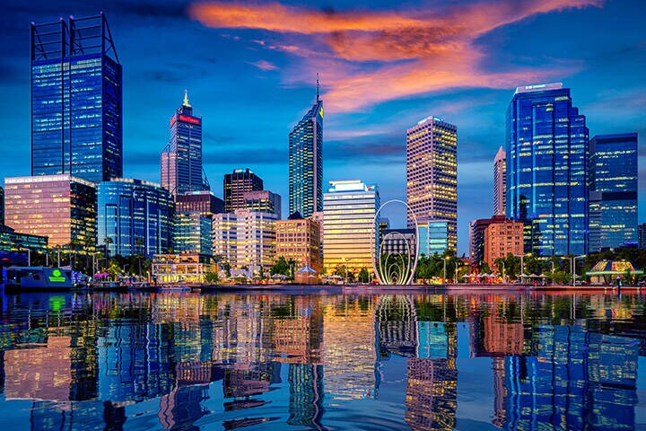 Perth city skyline across the Swan River at sunset