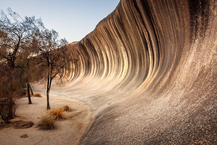 Wave Rock, a 15 metre high natural rock formation that is shaped like a tall breaking ocean wave and is located at Hyden in Western Australia 