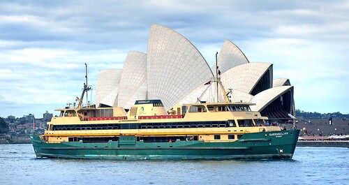Attractions and experiences - flights to sydney. Manly ferry and the Sydney Opera house on a sunny day.