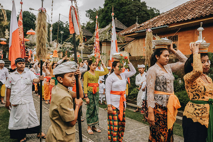 Local villagers in traditional Balinese outfits in Penglipuran Village