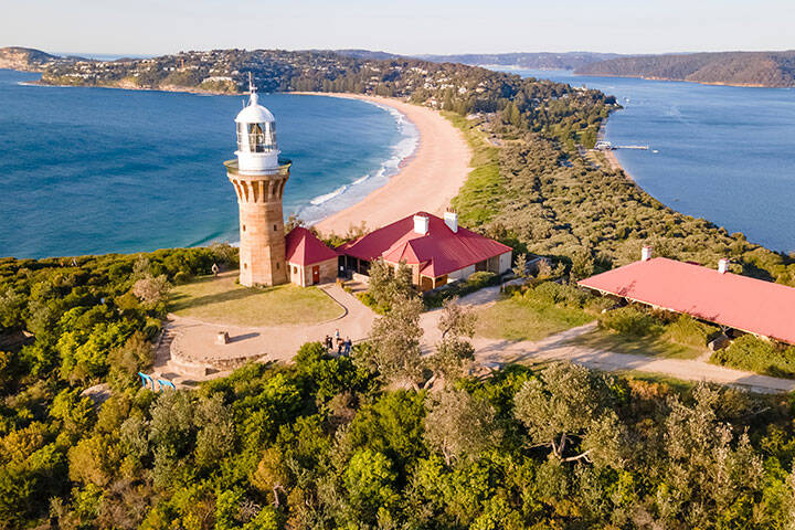 Aerial drone view of Barrenjoey Head Lighthouse at Barrenjoey Headland, Palm Beach, Northern Beaches in Sydney, New South Wales, Australia on a sunny morning 
