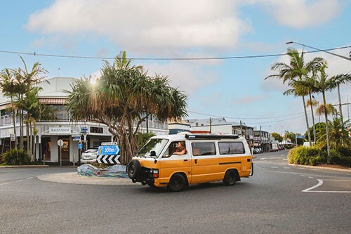 Yellow combi can at a roundabout while driving through Byron Bay centre. Credit: Destination NSW