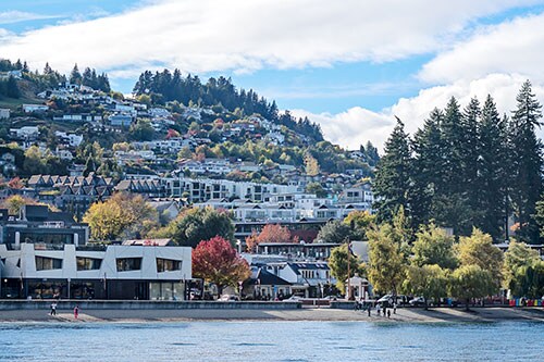 Hotels on the shore Of Queenstown New Zealand, As Seen From Lake Wakatipu